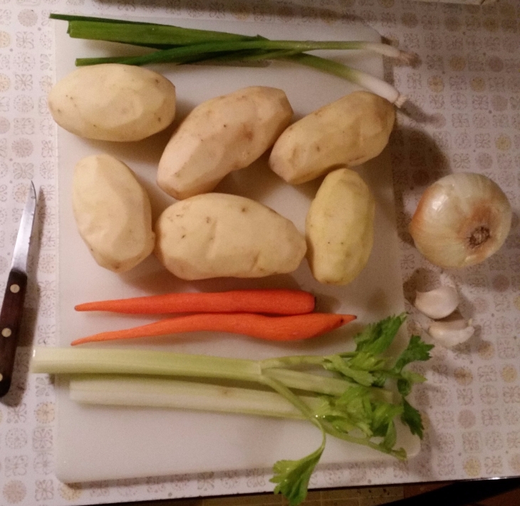 6 potatoes, 2 carrots, 1 1/2 stalks of celery, 2 green onions, half of a yellow onion, and 2 cloves of garlic